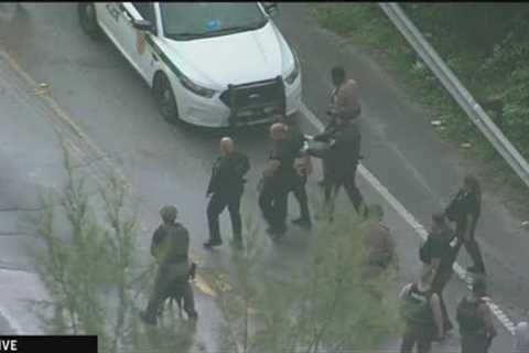 Man in custody after traffic stop in Miami-Dade leads to pursuit, foot chase and swim in canal