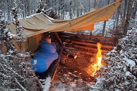 Winter Camping in Snow Storm with Survival Shelter & Bushcraft Cot.